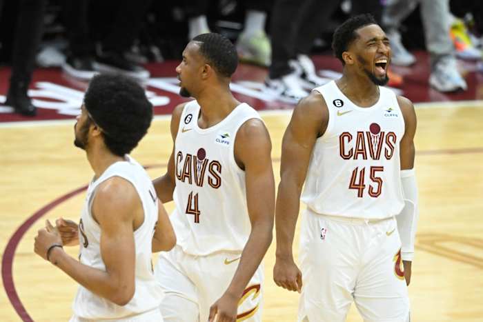 Apr 15, 2023; Cleveland, Ohio, USA; Cleveland Cavaliers guard Donovan Mitchell (45), right, celebrates against the New York Knicks in the fourth quarter of game one of the 2023 NBA playoffs at Rocket Mortgage FieldHouse.